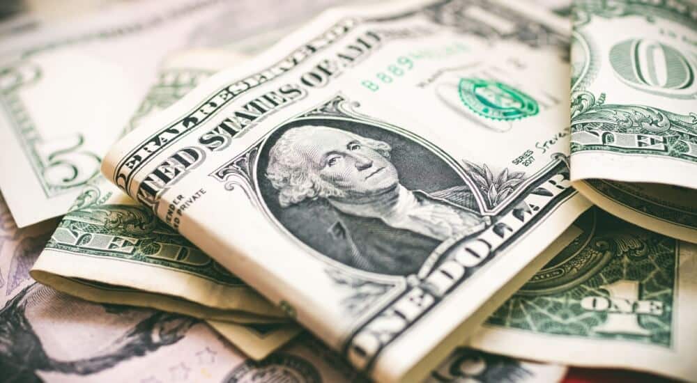 USD edges higher, but records weekly loss